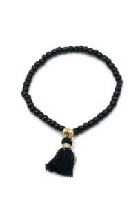 Armbandje van glaskraaltjes met kwastje